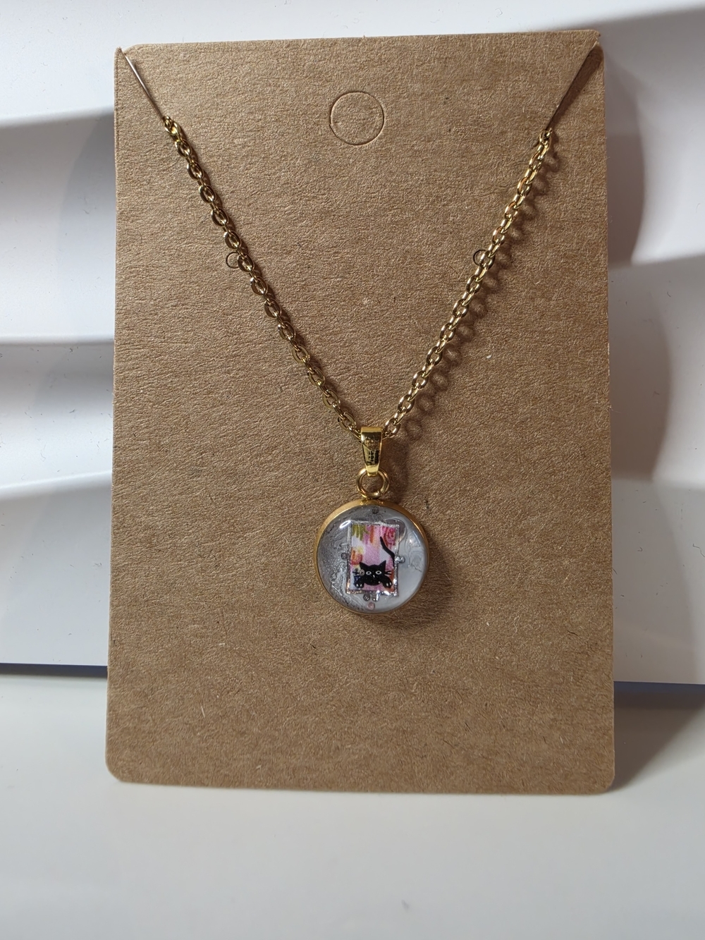 Gold Cat Pendant Necklace with Pink Accent